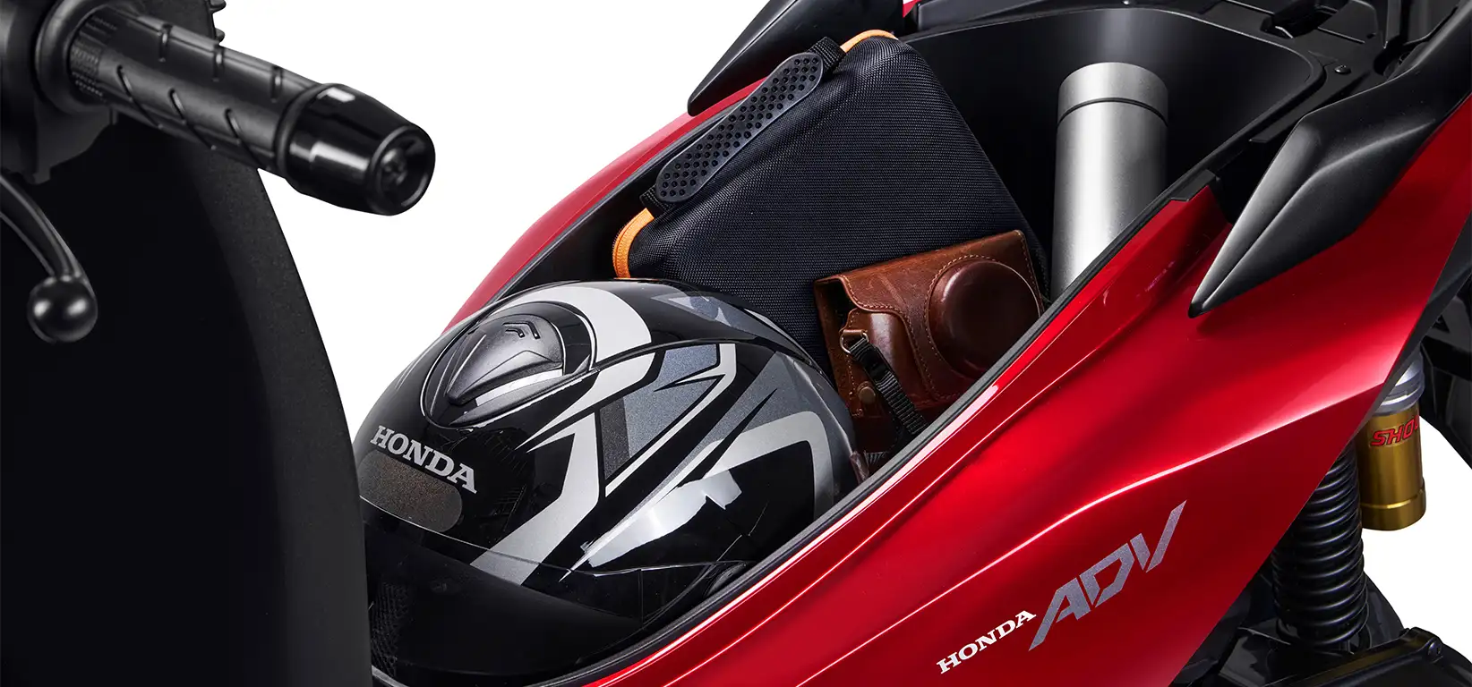 Dá pra fazer a feira: conheça 5 scooters com o grande "espaço interno" 2 Porta-objetos da Moto Honda ADV Vermelho